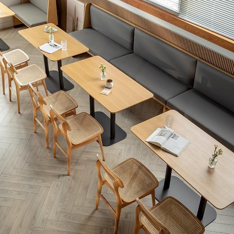 Banquette with Long Table and Rattan Chairs