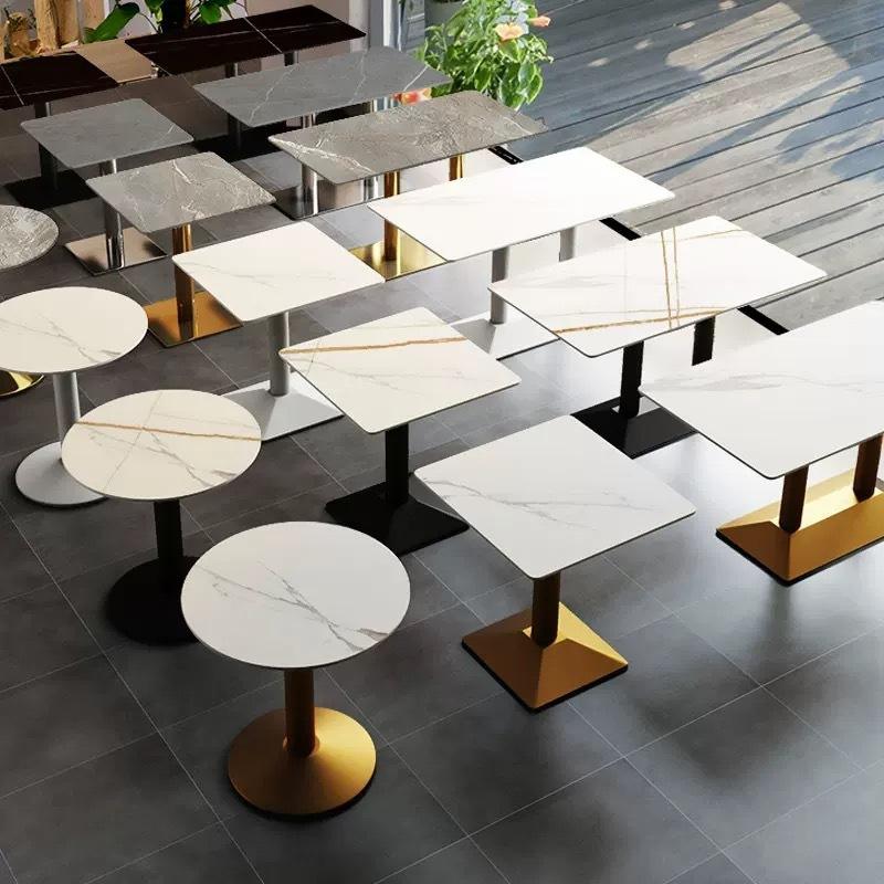 Square and round tops in white and black marble effect