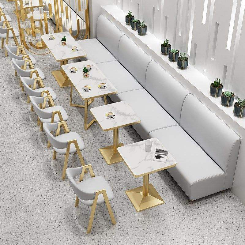 Square tables paired with a banquette