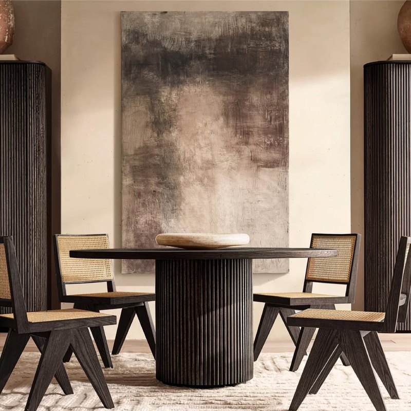 Black oak version paired with cane-back dining chairs in a dark dining room