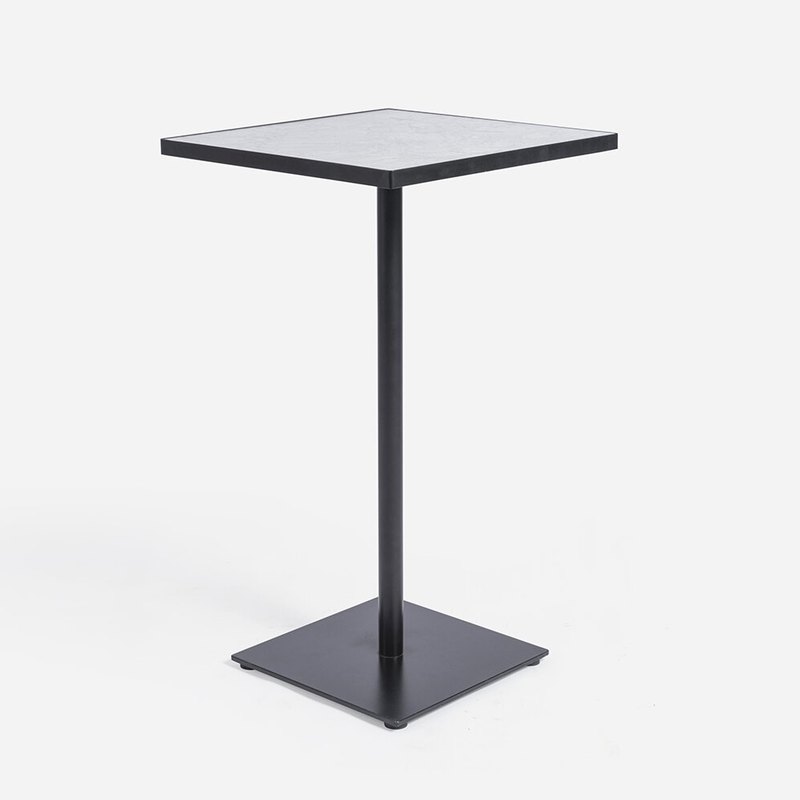 Same table seen from the corner, showing the square plate base and slim column