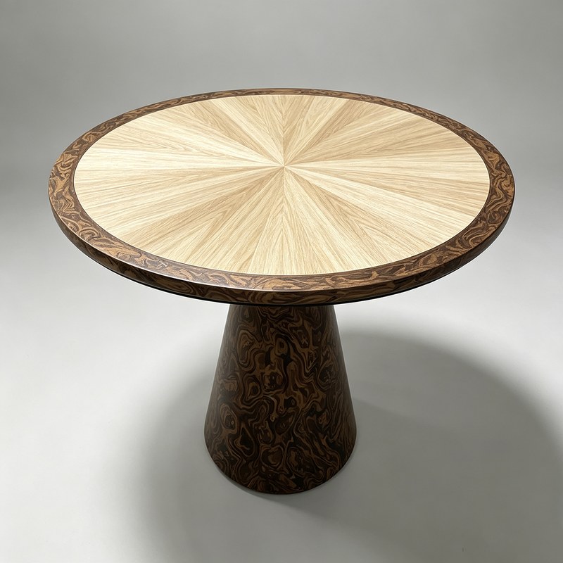 Angled view of the radial marquetry top with the veneer segments meeting at the centre