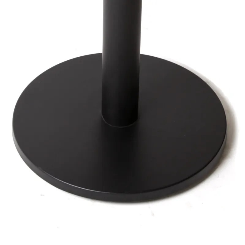 Close-up of the black powder-coated disc base and the column welded to it