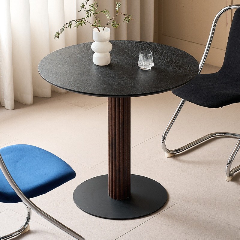 Black textured top with a dark walnut fluted pedestal and black disc base