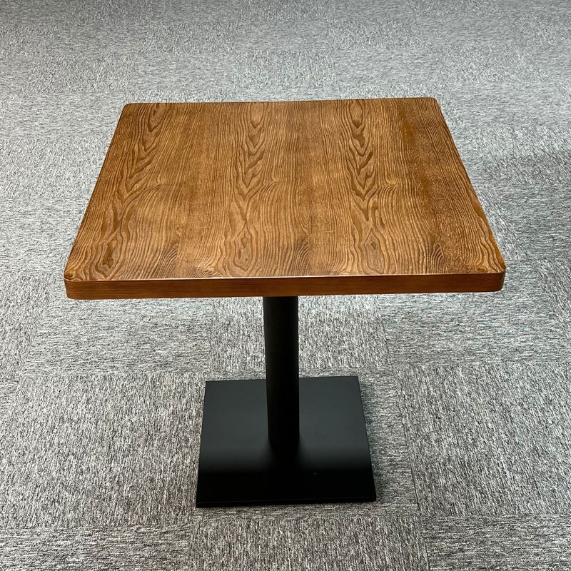 The same table photographed on a carpeted floor, showing the top grain from above