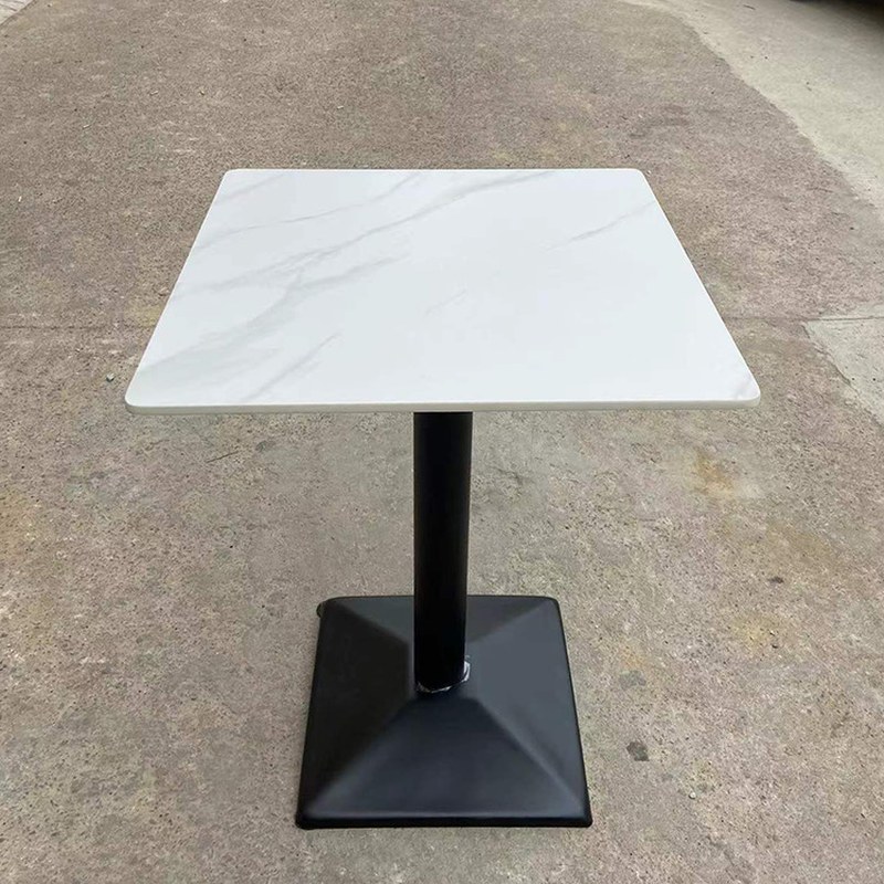 The same square base carrying a white slab top with grey veining