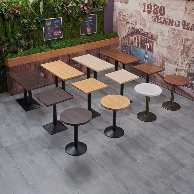 Several tops on the same pedestal system laid out in the supplier's showroom